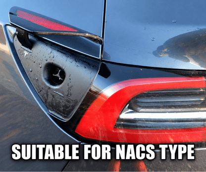 Close-up of the rear left side of a dark gray or black car, showing the fuel door cover, taillight, and body panel with some dirt and reflections. Tesla-Model-Y-3-replacement-charger-port-door-1084854-99-J-ccs-nacs-buy-from-ireland-europes-teslary