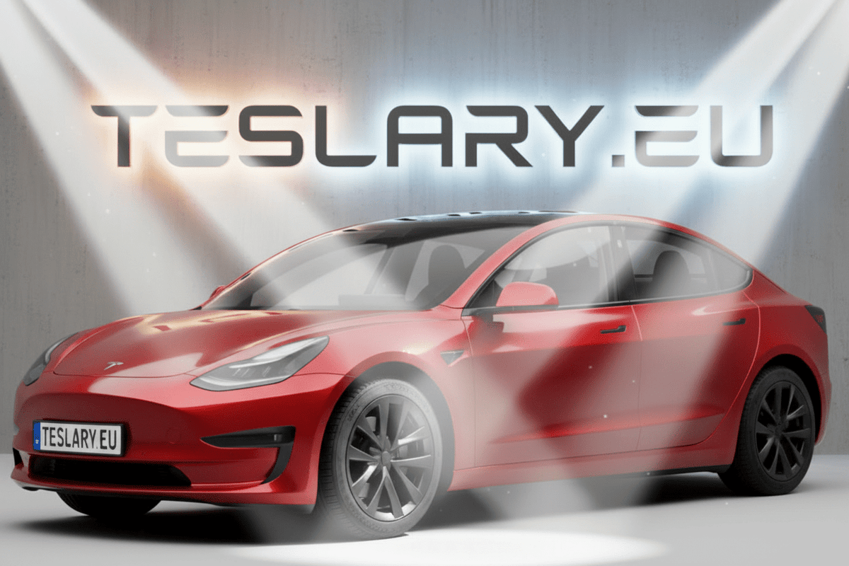 A red Tesla Model 3 sedan shown in a stylized studio setting with spotlights and the large text TESLARY.EU behind it. tesla-model-3-18-arachnid-style-wheel-covers-teslary-dublin-ireland-cork-nederlands-deutschland-espana-alicante-madrid-tesla-accessories-shop-europe-france-ital-4448983