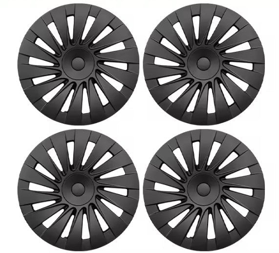 Four black multi-spoke hubcaps arranged in a 2x2 grid on a plain white background.